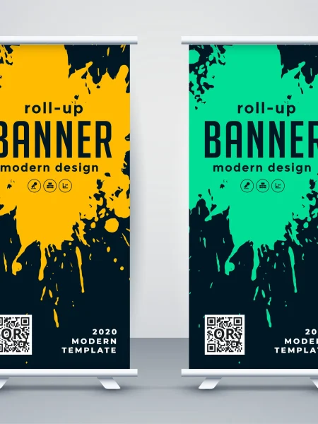 Dos roll up banner con diseño moderno, destacando manchas de pintura en tonos amarillo y verde sobre un fondo oscuro, para captar la atención en eventos.